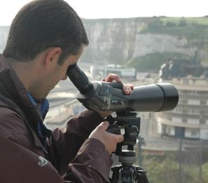 Looking through telescope