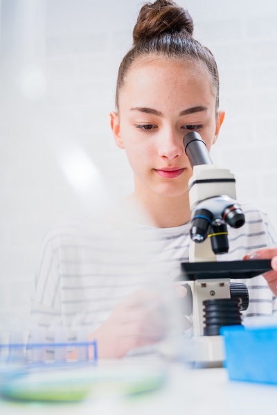 Girl Using a Microscope